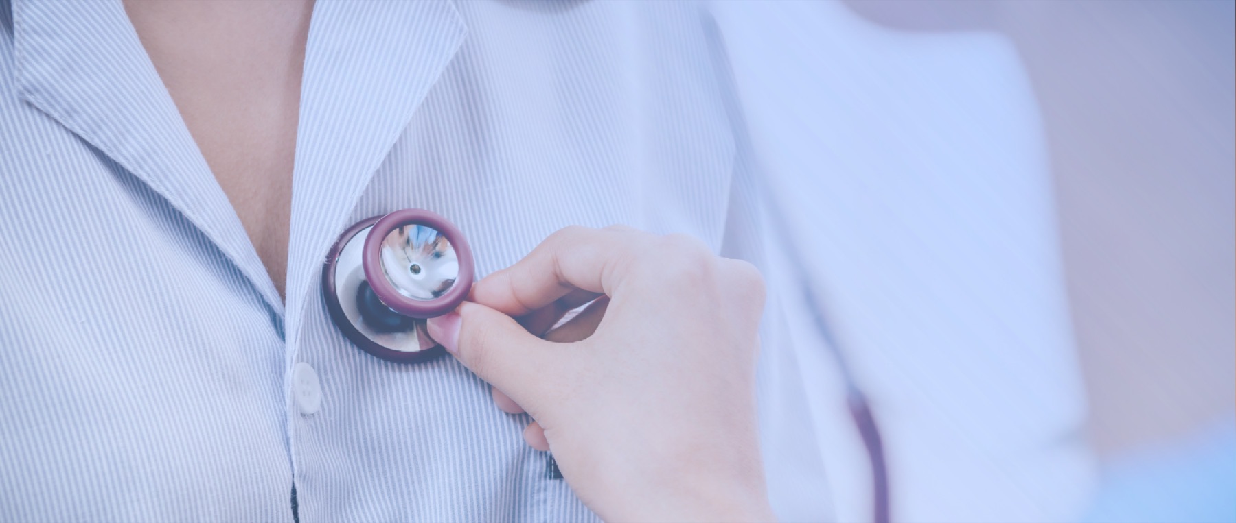 Clinician holding a stethoscope
