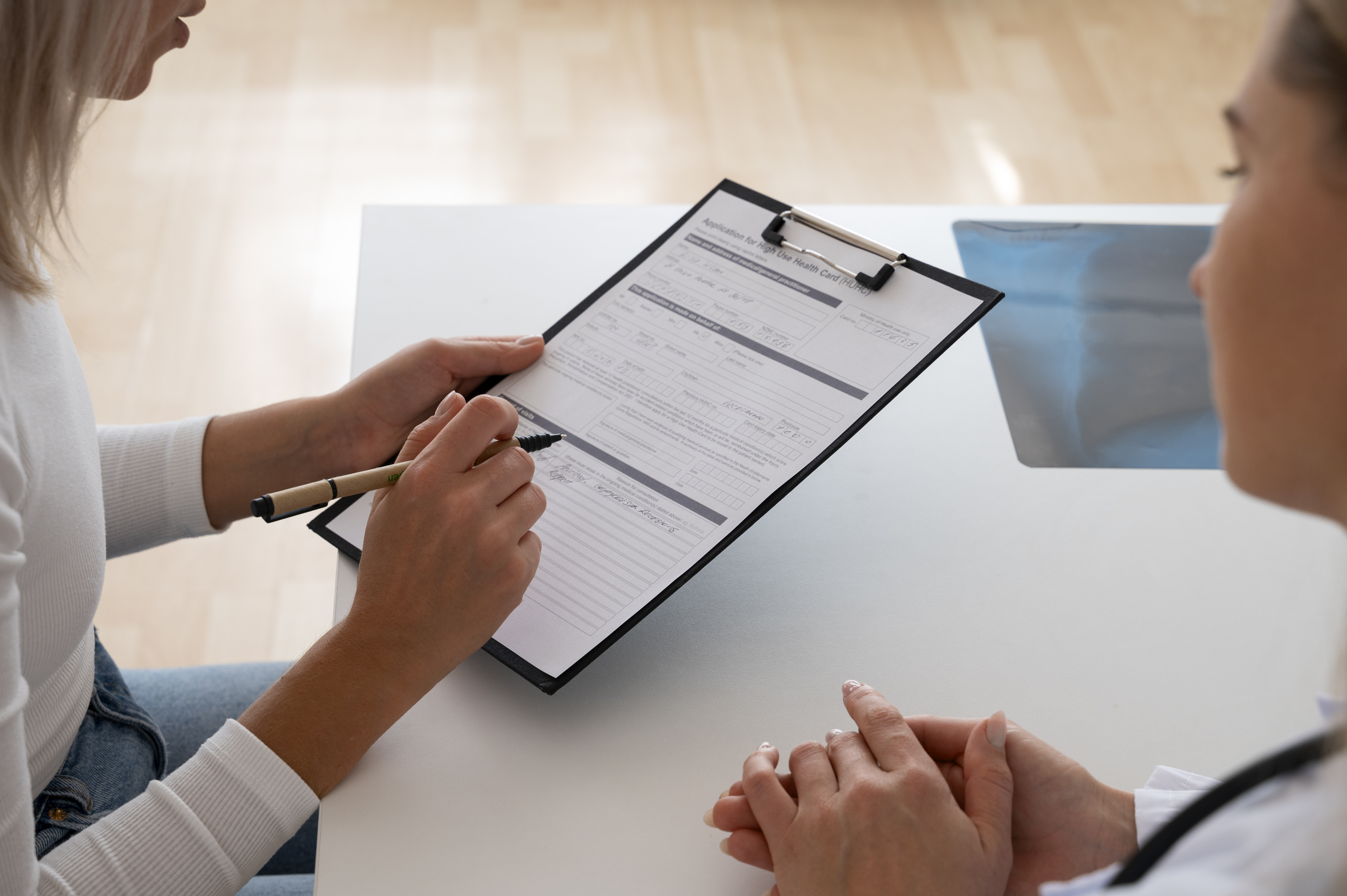 Patient completing a medical consent form