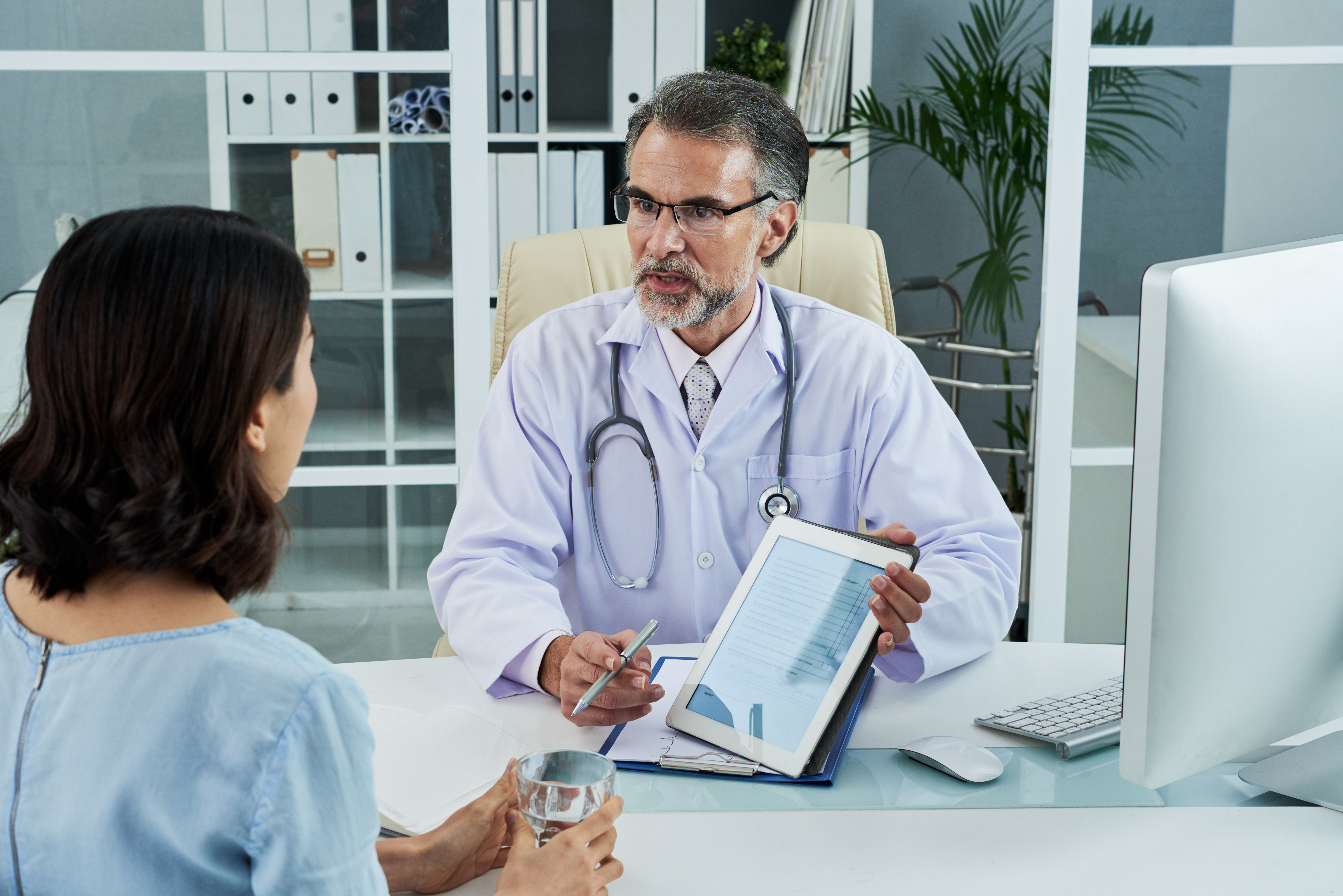 Physician explaining a diagnosis to a patient