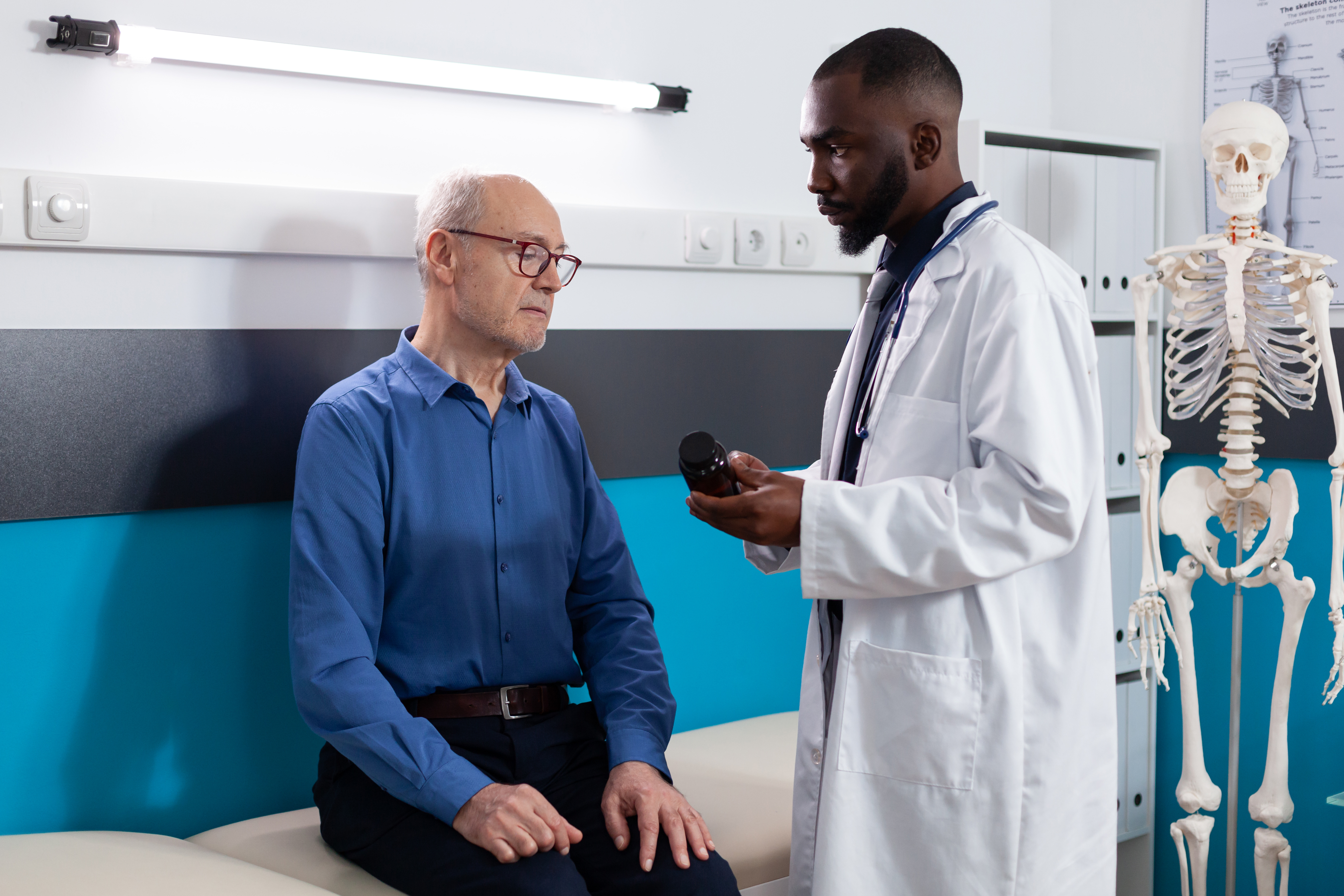 Physician reviewing medication with an older patient